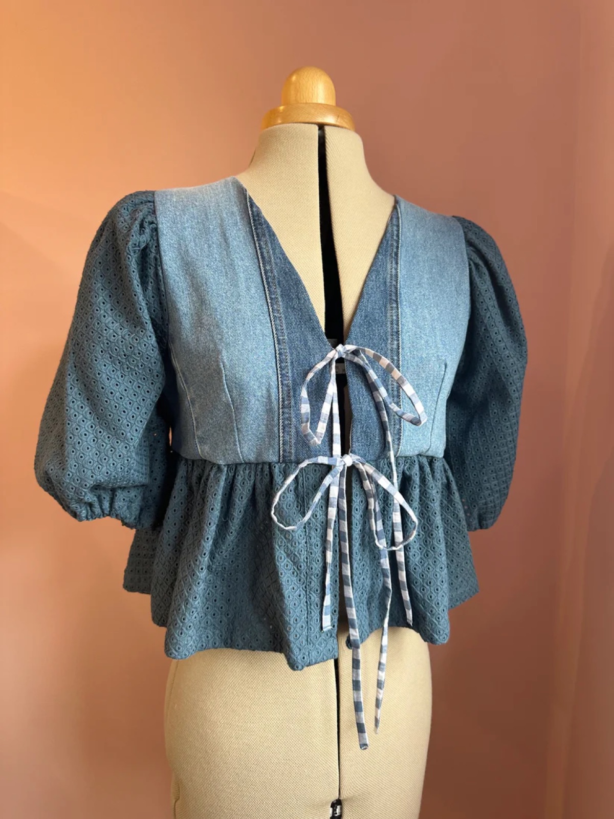 Upcycled clothing on a hanger